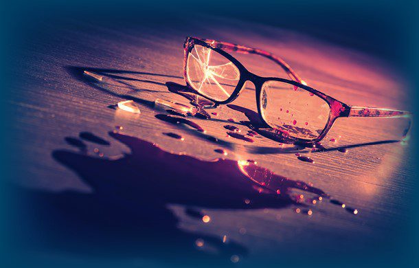 Broken glasses with a cracked lens